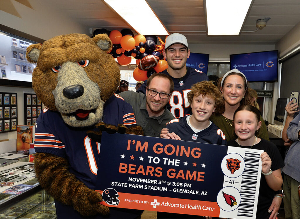 At Mark’s Card Shop, Bears player Cole Kmet, mascot Staley, and the Davis family surprise Jonah with the news that he was selected for the VIP Bears Trip.