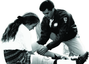 Kaufman treating a field hockey injury.