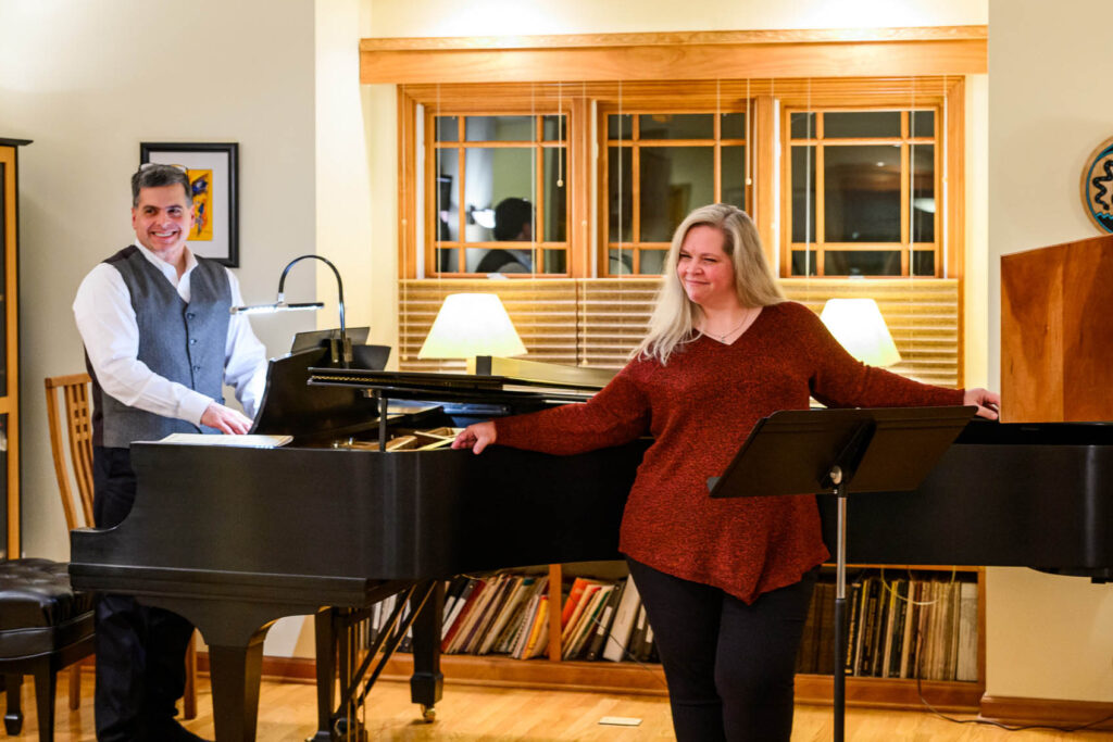 DGMC board member Chris Garofalo 
accompanies a vocalist at a DGMC benefit 
concert held at his home.
<br><i>Photo by T. F. Ewing, DGMC</i>