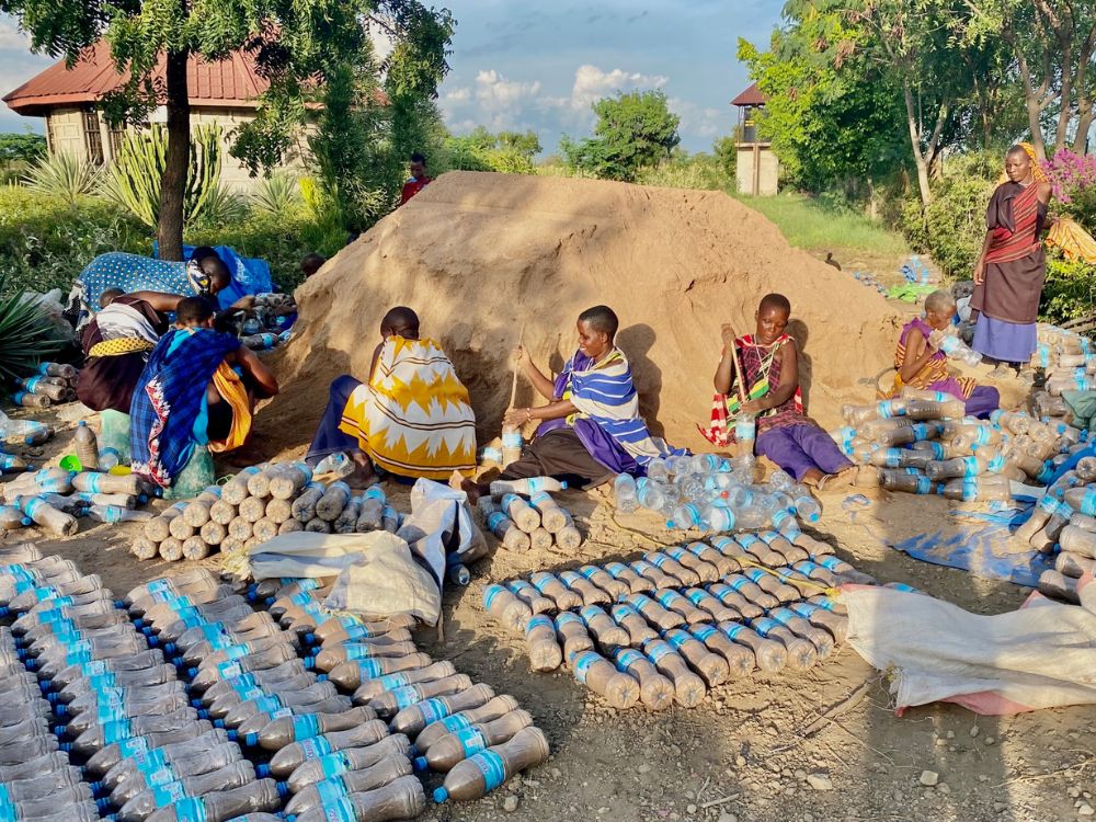 Local widows were hired to fill 26,000 plastic bottles that were reclaimed from African roadsides.