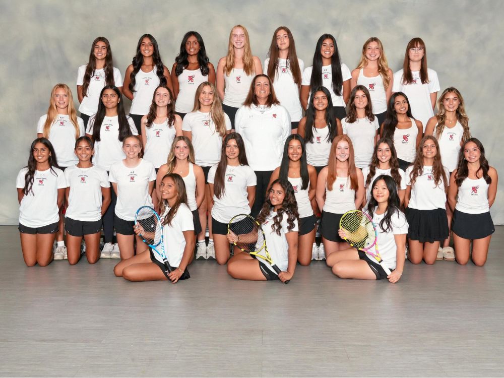 Oak Brook’s Shawna Zsinko has guided the Hinsdale Central varsity girls tennis program for the past nine seasons. Pictured with her is the current varsity team.